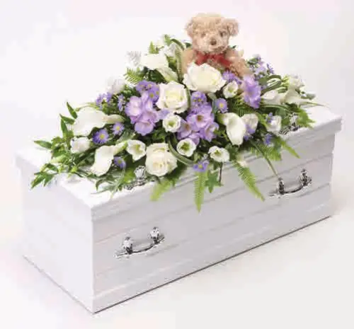 Children’s casket spray with teddy bear, blue and lilac, from our children’s flowers